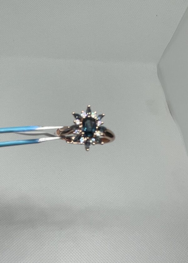 Ocean Bloom: The Teal Sapphire Starburst Ring